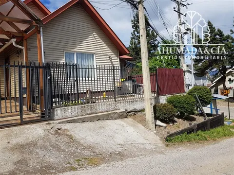 Exterior view of a two-story house on Coraceros in Coyhaique