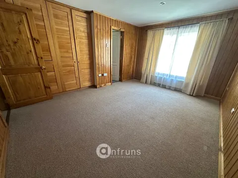 Kitchen with island and appliances in Coyhaique