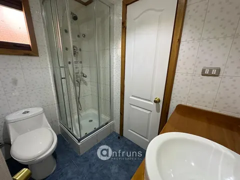 Laundry room with storage in a Coyhaique house