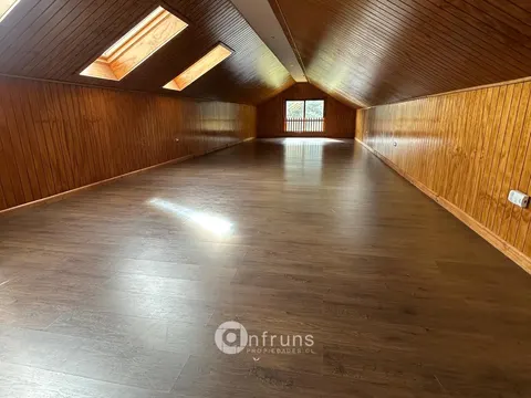 Family room with fireplace in a Coyhaique home