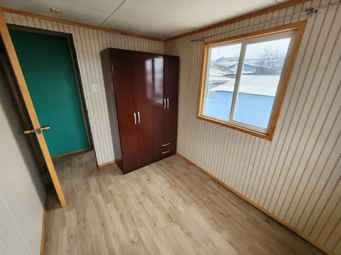 Living room with large windows and pellet stove