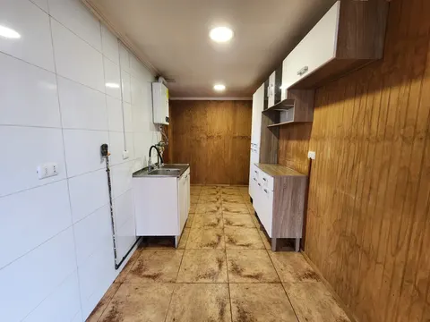 Kitchen with wooden cabinets and counter