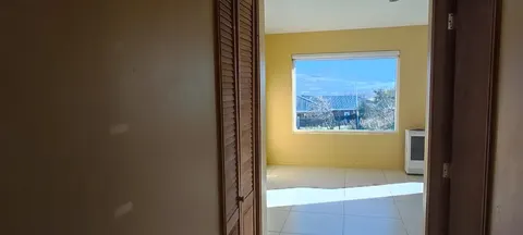 Master bedroom with window and view