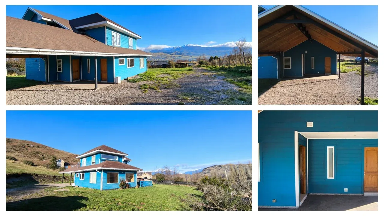 Turquoise house exterior with mountain backdrop