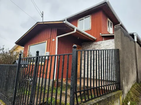 Two-story house with front yard in Coyhaique