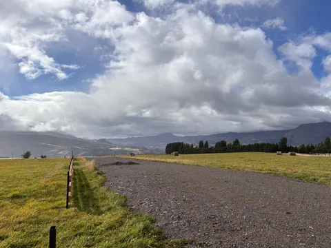 Open sky over a plot with potential building site marked