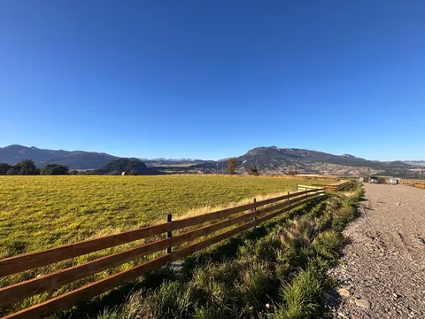 View from a plot towards Coyhaique city and Cerro Mackay
