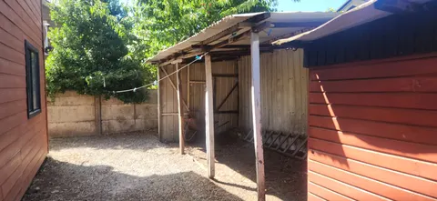 Second bathroom with toilet and vanity in Coyhaique