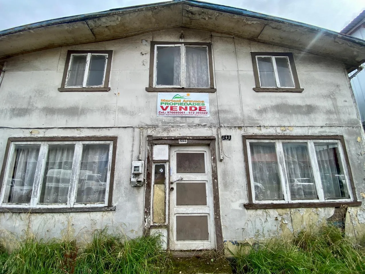Front view of a central property in Puerto Aysén with commercial potential