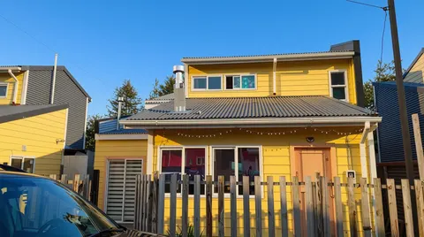 Front view of a furnished house with a large yard in Puerto Aysén