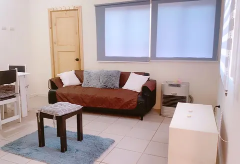 Master bedroom with built-in closet and window view