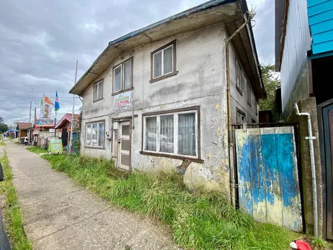 Side elevation of the building showing its urban location