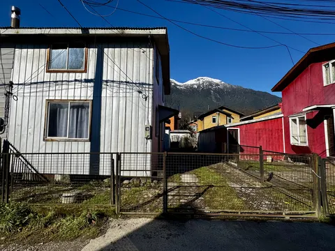 Front facade of the property with a small garden area